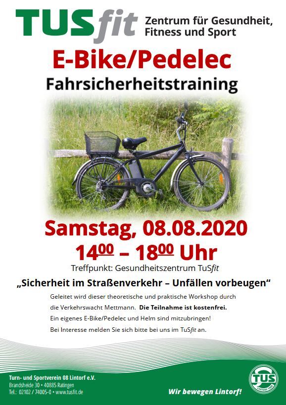 E-Bike mit Korb steht auf einer Wiese, im Hintergrund Informationen zum Fahrtraining am 08.08.2020.