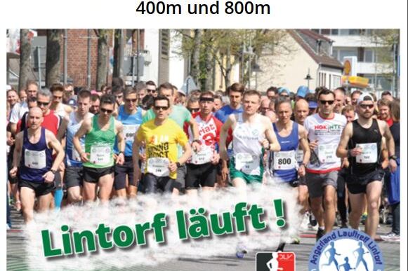 Teilnehmer des 13. Citylaufs Lintorf laufen im Stadion, umgeben von Zuschauern, am 12. Juni 2022.