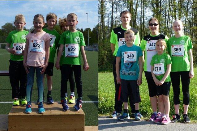 Gruppe von Sportlern in gr&uuml;nen T-Shirts auf einem Siegertreppchen und einem Freiluftgel&auml;nde.