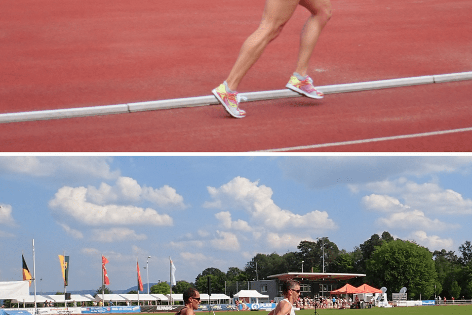 Zwei L&auml;ufer in Sportbekleidung sprinten auf einer roten Laufbahn, umgeben von Zuschauern und bunten Fahnen.