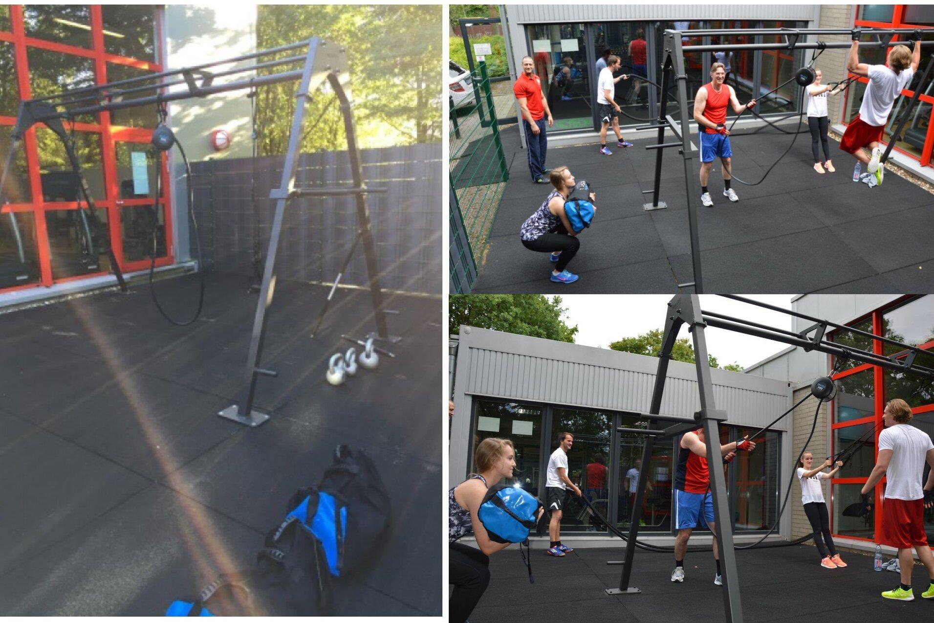 Fitnessbereich mit Trainingsger&auml;ten und mehreren Personen, die unterschiedliche &Uuml;bungen auf einem Gummiboden ausf&uuml;hren.