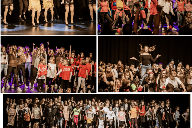 Gruppentanzauff&uuml;hrung auf einer B&uuml;hne mit T&auml;nzern in bunten Kost&uuml;men und fr&ouml;hlicher Stimmung.