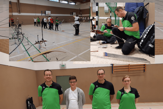 Mehrere Bogensch&uuml;tzen trainieren in einer Halle, w&auml;hrend einige Personen im Vordergrund posieren.