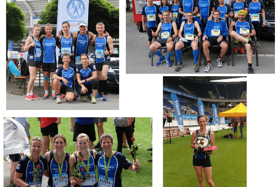 Gruppenfoto von L&auml;ufern in blauen Trikots, um einen Meeting Point Banner, vor einem Stadion.