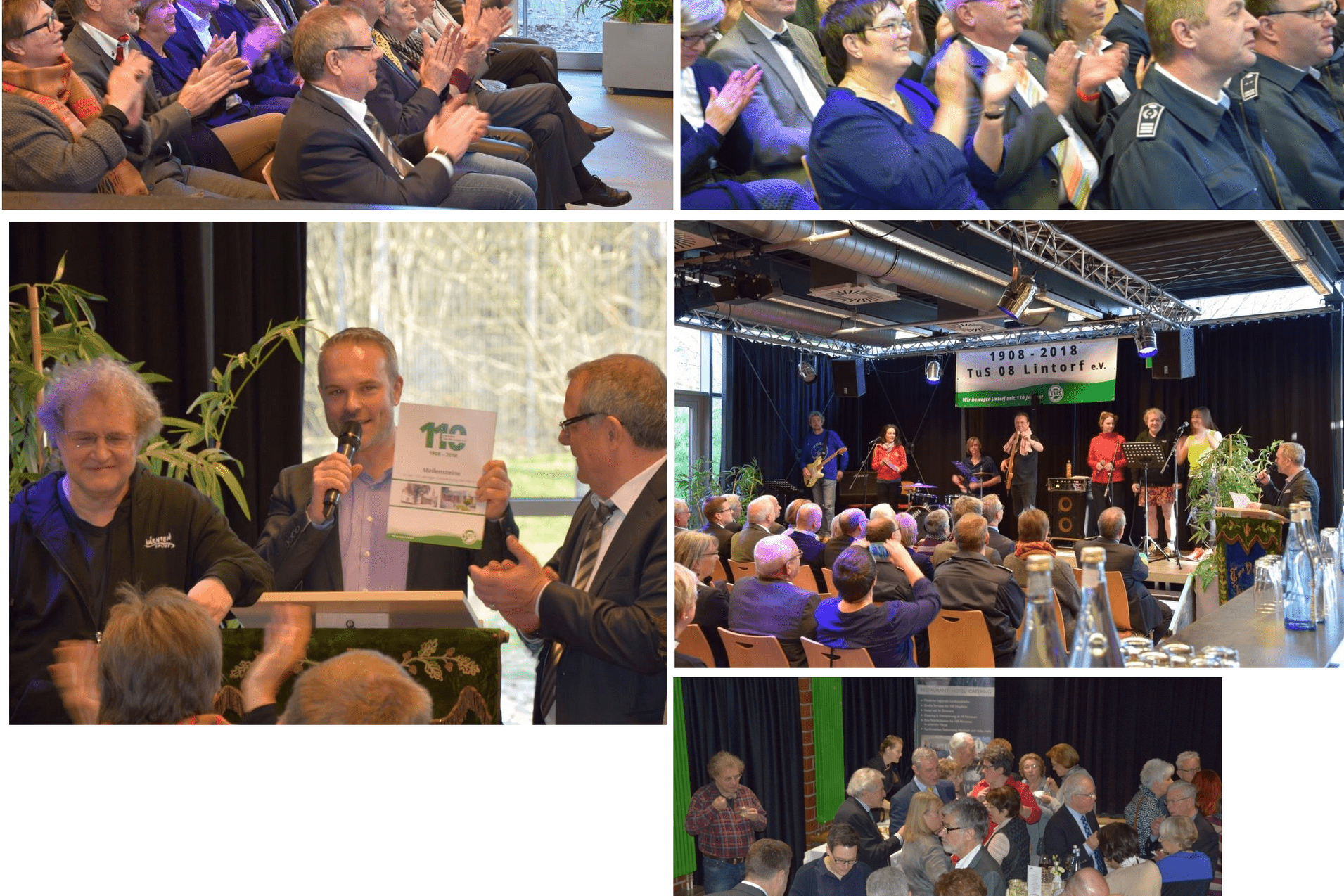 Veranstaltung mit applaudierenden Gästen in einem Saal, Redner an Mikrofon und Ehrung auf der Bühne.