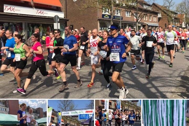 L&auml;ufer in bunten Outfits starten bei einem Stra&szlig;enlauf durch eine belebte Stra&szlig;e an einem sonnigen Tag.